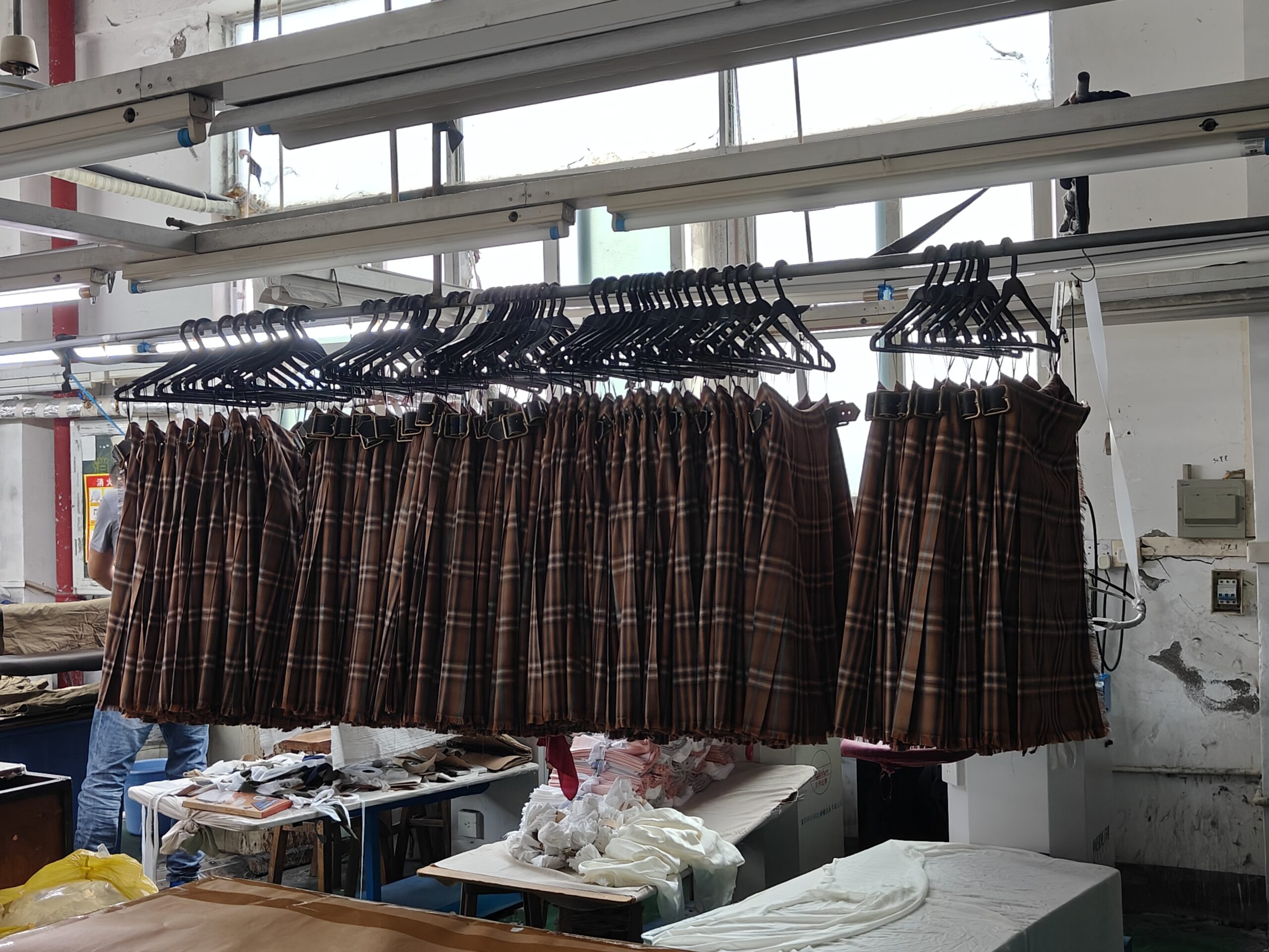 Tetramade professional woven garment production line - plaid skirt bulk manufacturing.