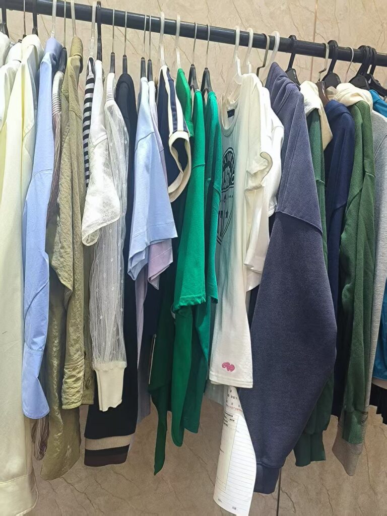 High-quality woven trousers on display at Tetramade's Shenzhen sample room, showcasing premium fabric and precise stitching.