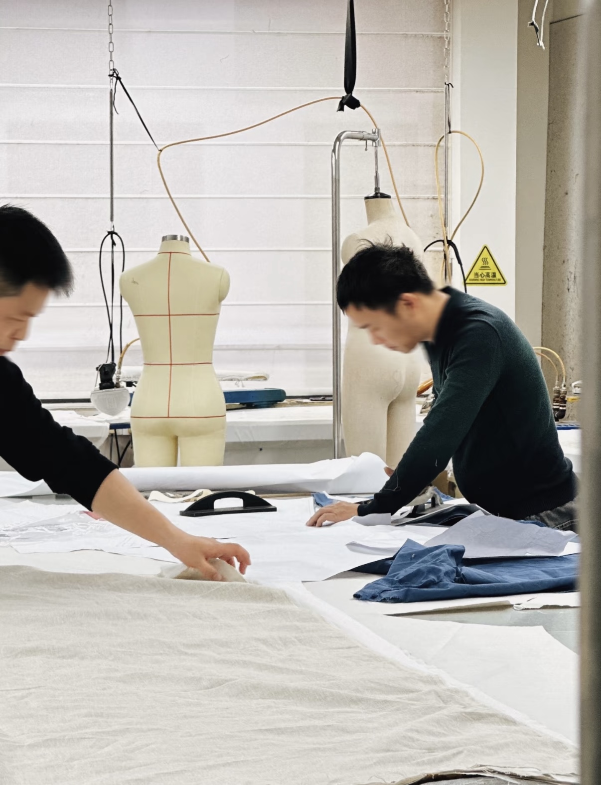 Precision fabric cutting and sequential assembly lines at Tetramade factory.