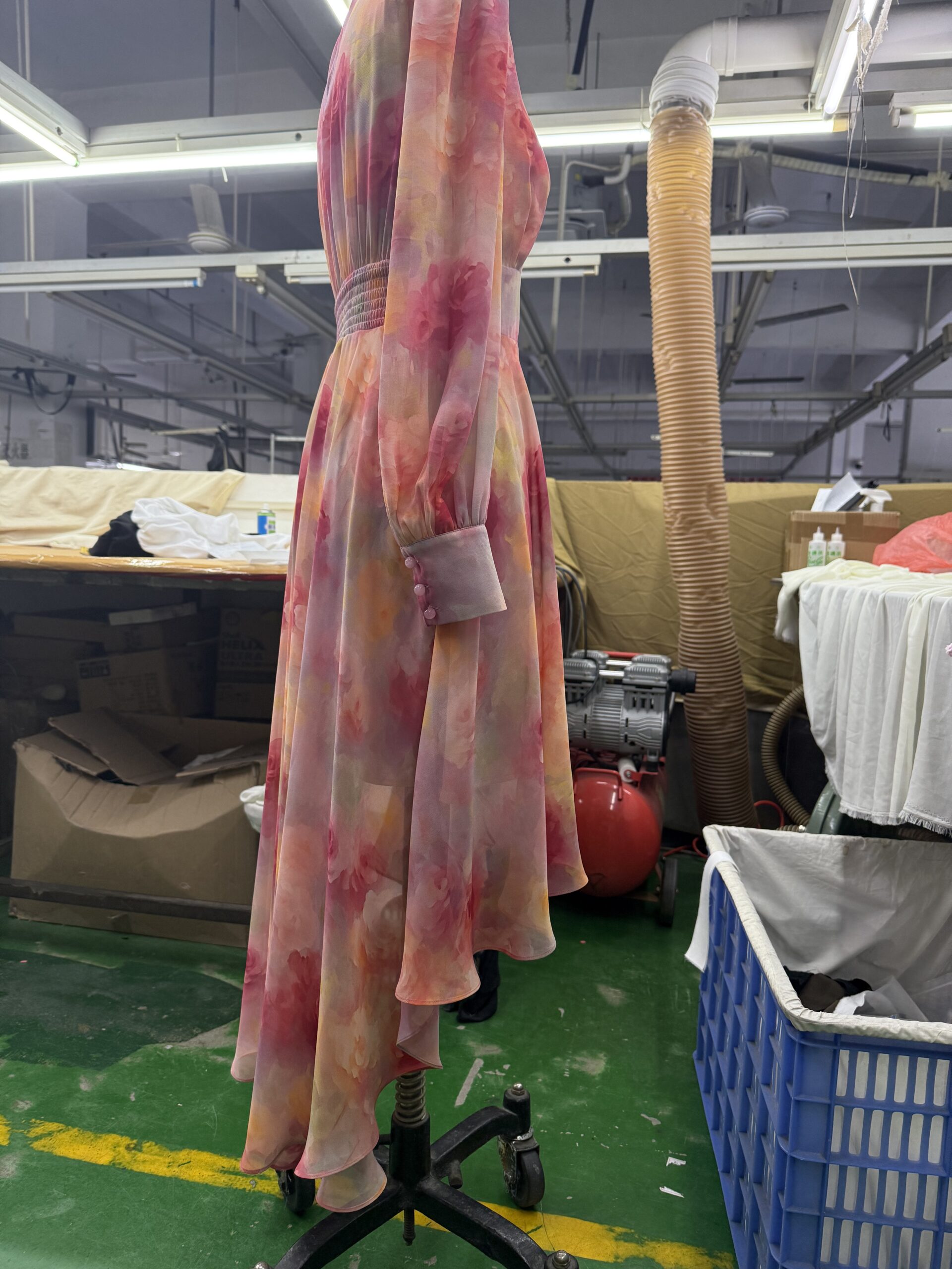 Services Elegant yellow printed maxi dress sample on a mannequin, developed by Tetramade for boutique fashion brands.